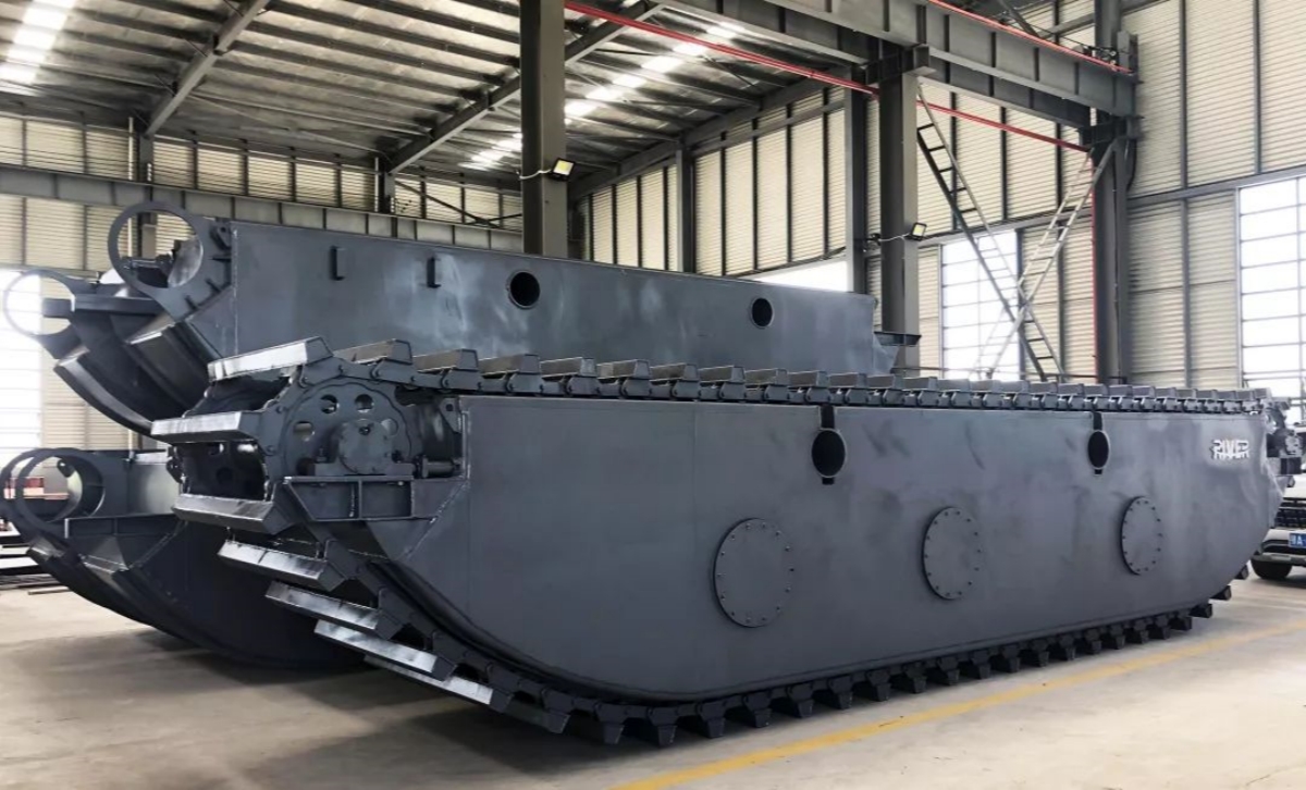 Wide tracks and potoons of amphibious excavators